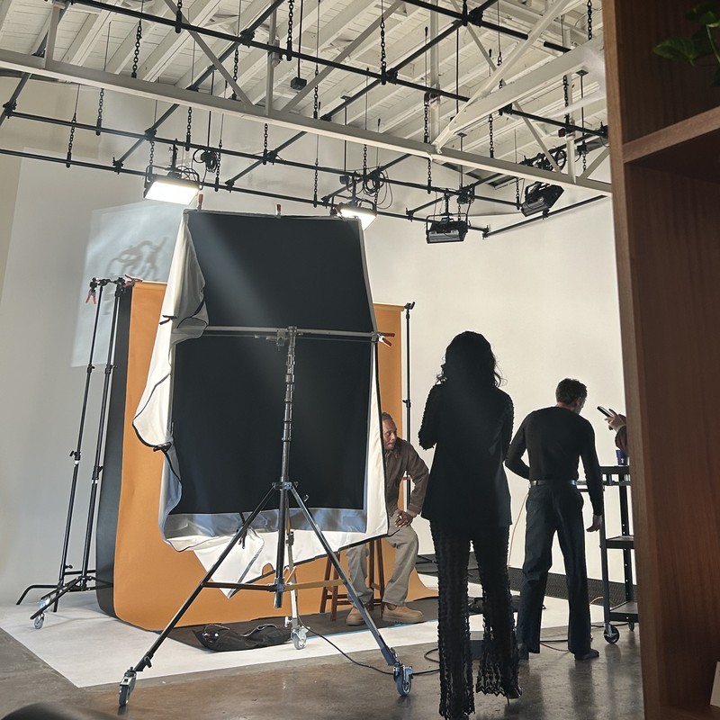 Behind the scenes on a portrait shoot in a studio
